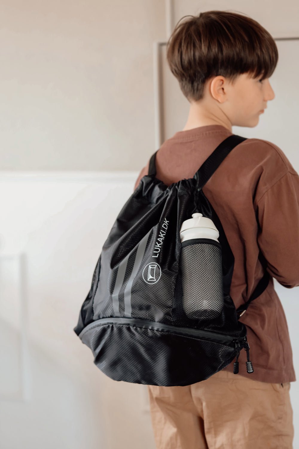 Sportsrygsæk med boldholder og skorum - vandafvisende og praktisk sampak - Lukaki.dkSportsrygsæk med boldholder og skorum - vandafvisende og praktisk sampak